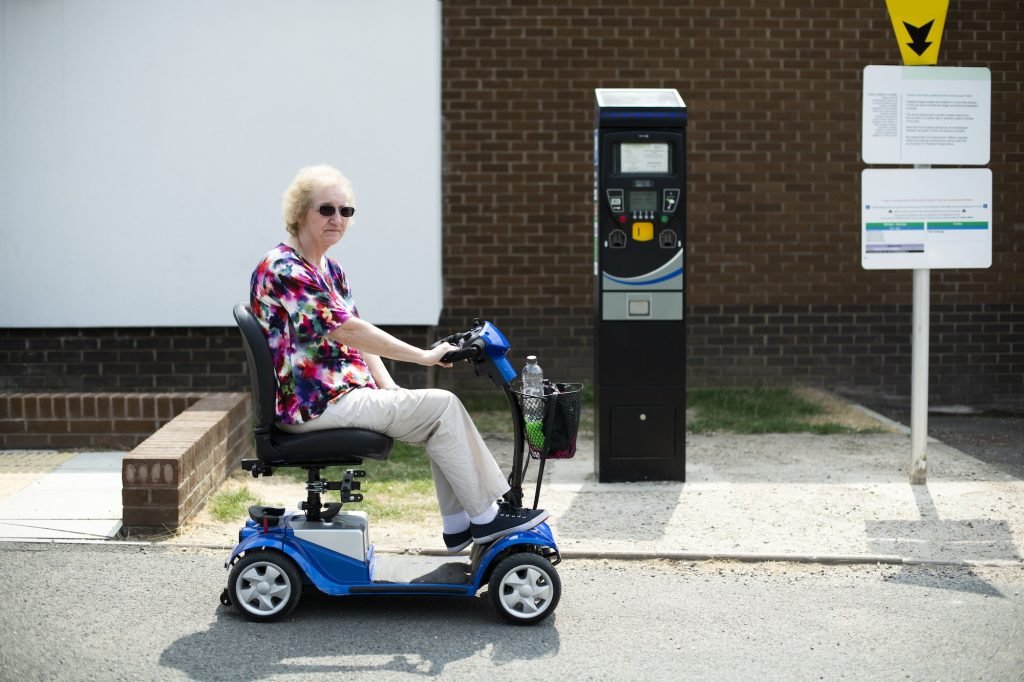 Senior woman on an electric wheelchair